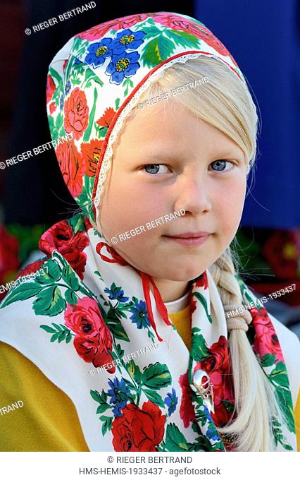 Sweden, Dalarna County, Leksand area, Midsummer celebrations in the tiny hamlet of Hjulback, girl in traditional costume