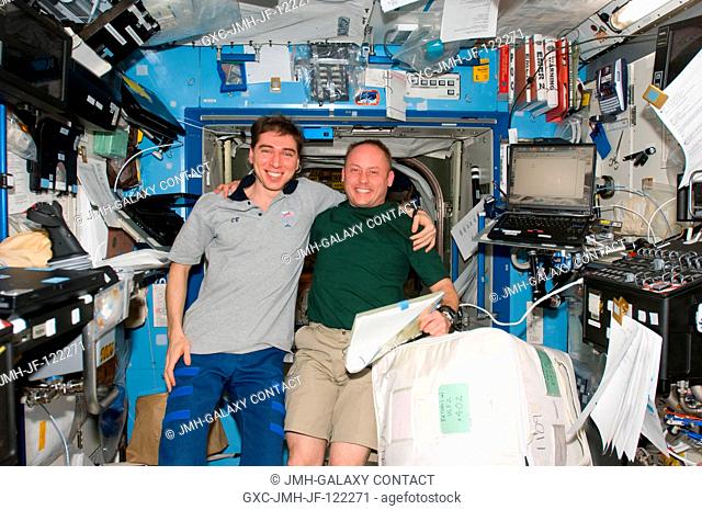 Cosmonaut Sergei Volkov (left), Expedition 17 commander, and astronaut Michael Fincke, Expedition 18 commander, take a moment for a photo in the Destiny...