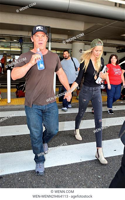 Josh Brolin holds hands with fiance Kathryn Boyd as they arrive at Los Angeles International Airport Featuring: Josh Brolin, Kathryn Boyd Where: Los Angeles