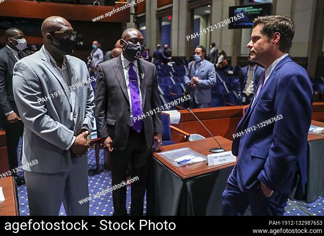 Republican Representative from Florida Matt Gaetz (R) speaks with George Floydís brother Philonise Floyd (L) and civil rights attorney Benjamin Crump (C) during...