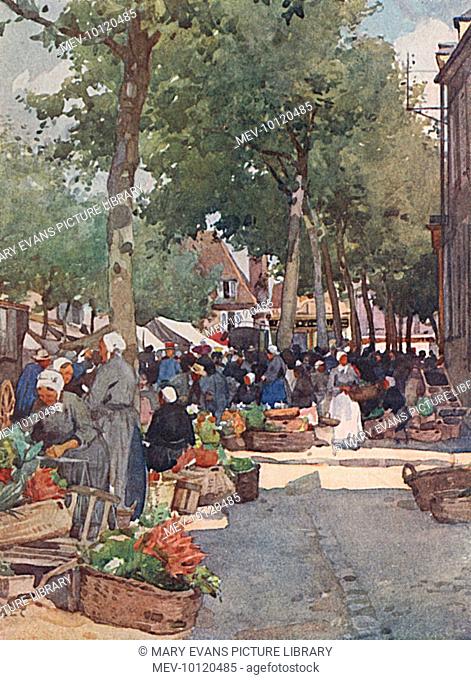 People buying and selling at a picturesque street market at Cosne