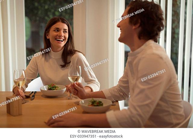 Couple having food together at home