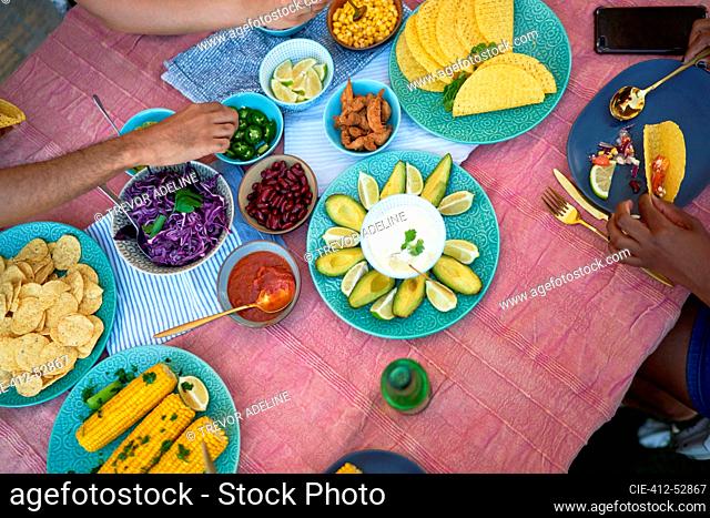 Taco shells and ingredients on patio table