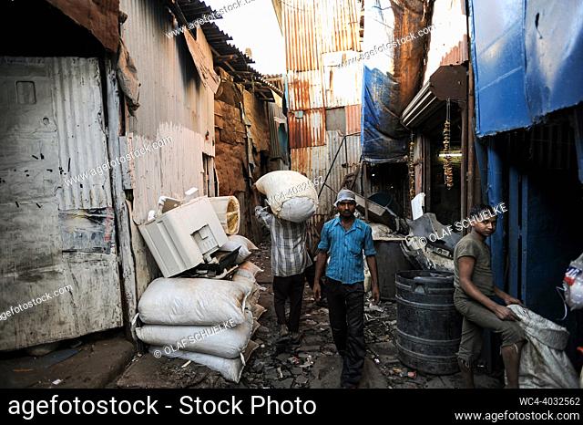 Mumbai, Maharashtra, India, Asia - Workers recycle recyclable waste material at a recycling business in the Dharavi slum area of Mumbai