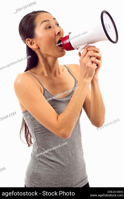 Beautiful Asian woman shouting through megaphone isolated over white background
