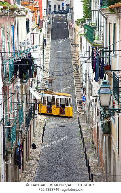 Bica funicular crossing the Travessa do Sequeiro street, Chiado district, Lisbon, Portugal
