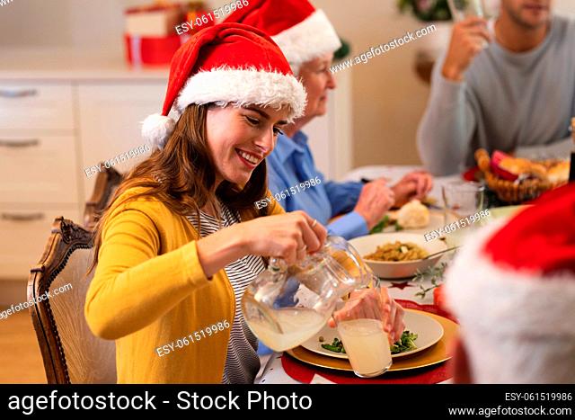 Caucasian woman sitting at table for dinner