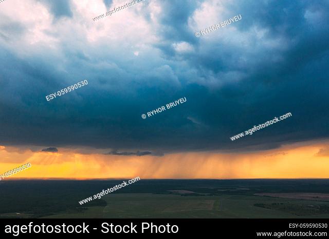Aerial View. Sunset Sky Above Green Forest, Meadow And Fields Landscape In Sunny Evening. Top View Of European Nature From High Attitude In Summer Sunrise