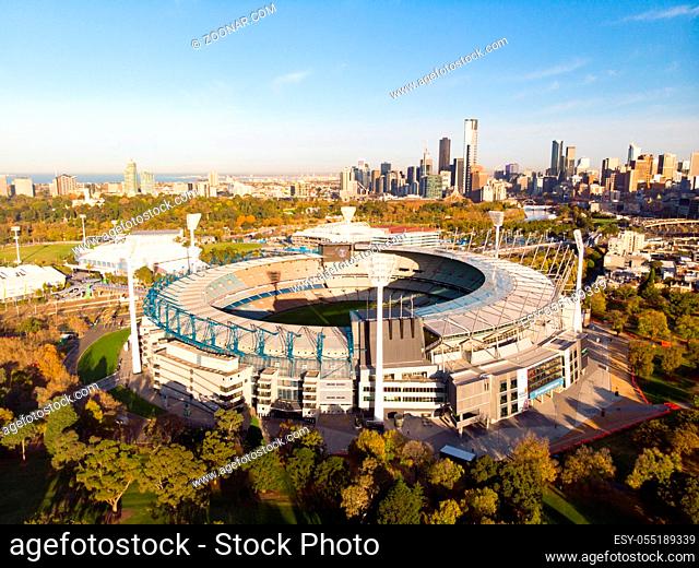 Melbourne's famous skyline with Melbourne Cricket Ground stadium in the foreground on a cool autumn morning in Melbourne, Victoria, Australia