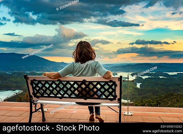 Woman overlooking amazing view of Ta Dung lake. Vietnam. Panorama landscape