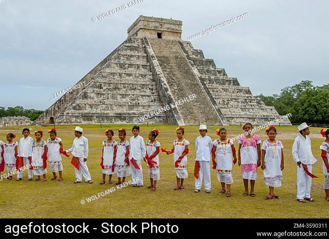 A group of Mayan children (dance group) visiting the Chichen Itza Archaeological Zone (UNESCO World Heritage Site) on the Yucatan Peninsula in Mexico