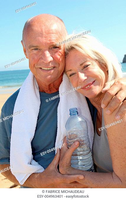 Portrait of athletic senior couple on the beach