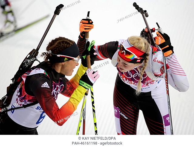 Evi Sachenbacher-Stehle (L) of Germany speaks with Lisa Theresa Hauser of Austria after the Women's Biathlon 7.5km Sprint in Laura Cross-country Ski & Biathlon...