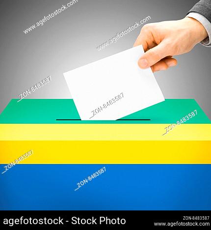 Voting concept - Ballot box painted into national flag colors - Gabon