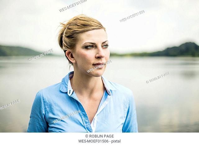 Portrait of woman at a lake looking sideways