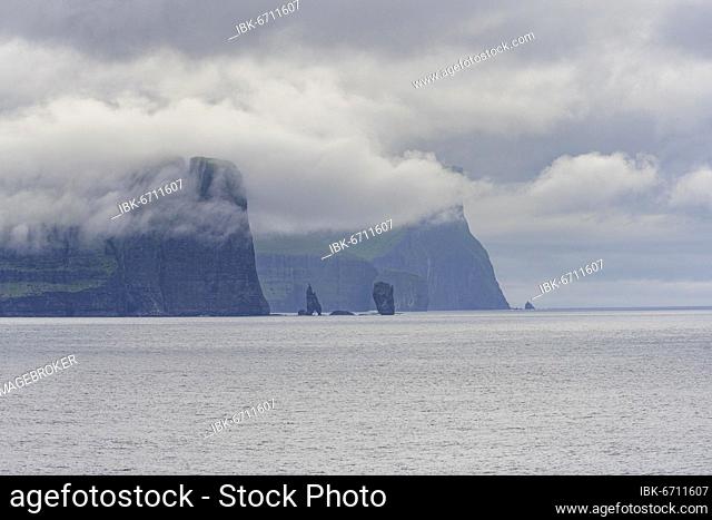 Risin and Kellingin rock needles next to 350m high cliffs, Esturoy, Faroe Islands, Europe