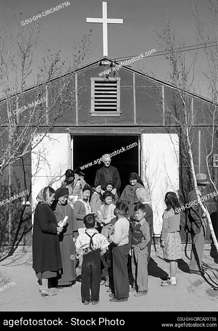 Group of People gathered outside Catholic Church, Manzanar Relocation Center, California, USA, Ansel Adams, Manzanar War Relocation Center Collection, 1943