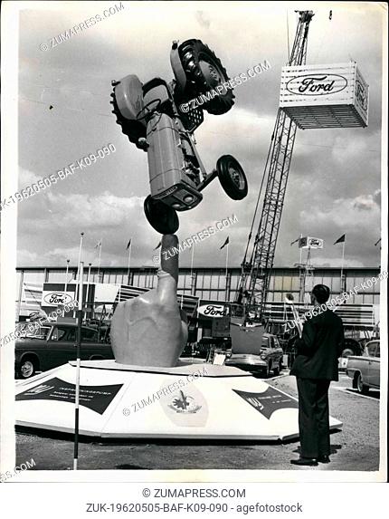 May 05, 1962 - Finger-Balanced Tractor: The tractor balanced on the finger of a giant hand is the tableau which greets visitors at the entrance of the British...
