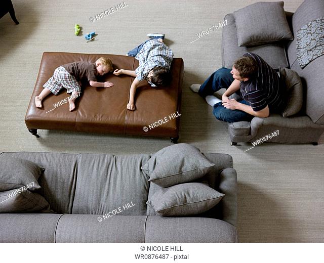 father and two sons in the living room