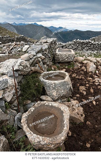 Old stone sinks, used by cowherds in the high pastures of the Taygetus mountains, Outer Mani, Peloponnese, Greece