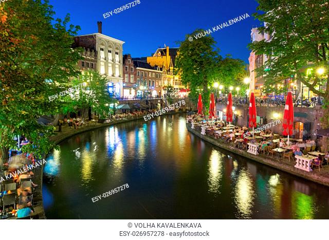 Canal Oudegracht in the colorful illuminations at night, Utrecht, Netherlands