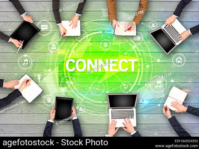 Group of people having a meeting with CONNECT insciption, social networking concept