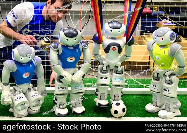 20 February 2020, Saxony, Leipzig: In the robotics laboratory of the Nao team of the University of Applied Sciences (HTWK) Tobias Jagla controls robot soccer...