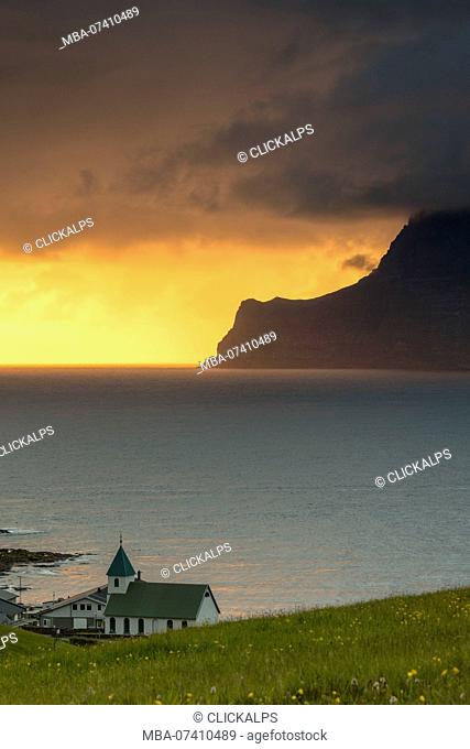 Church on the ocean shore towards Kalsoy Island, Gjogv, Eysturoy Island, Faroe Islands
