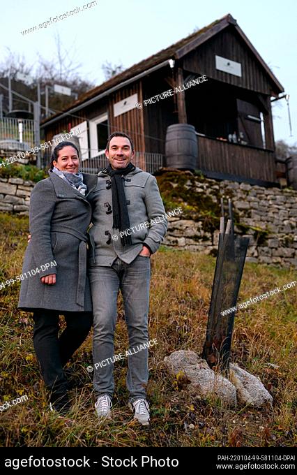 03 December 2021, Bavaria, Röttingen: Daniel Rudolf (r) and Cécile Radisson (l), hobby truffle farmers, are standing next to a tree ""inoculated"" with truffle...