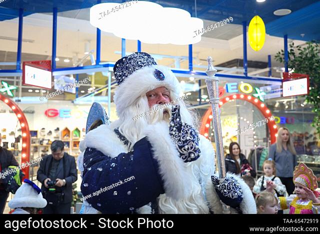 RUSSIA, MOSCOW - DECEMBER 4, 2023: A performer dressed as Father Frost (Russia equivalent of Santa) entertains children during a ceremony to open Father Frost's...