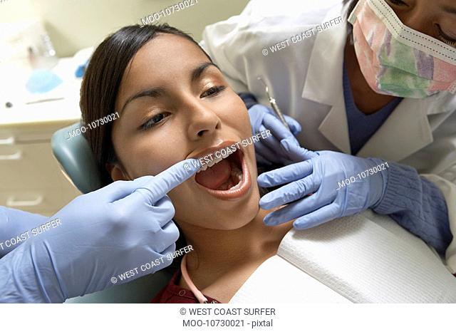 Teenage girl 13-16 at dentists close-up