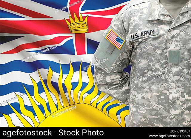 American soldier with Canadian province flag on background - British Columbia
