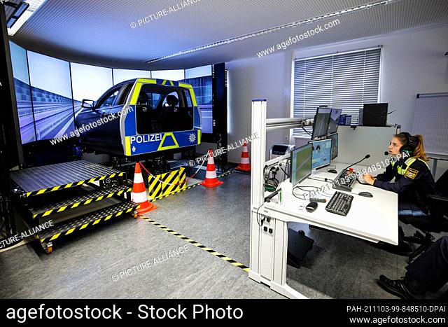 03 November 2021, Bavaria, Dachau: Police Sergeant Lea (20) operates the driving simulator during an appointment to present driving and rescue simulators in...