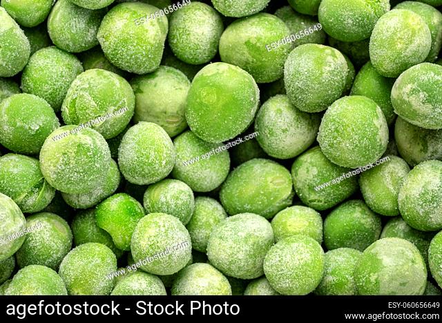 closeup background of frozen green peas