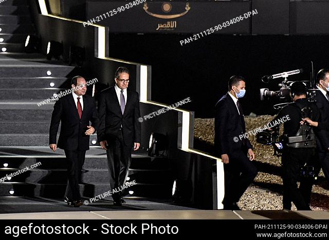 25 November 2021, Egypt, Luxor: Egyptian President Abdel Fattah el-Sisi (L) and Egyptian Minister of Antiquities & Tourism Khaled El-Enany attend the grand...