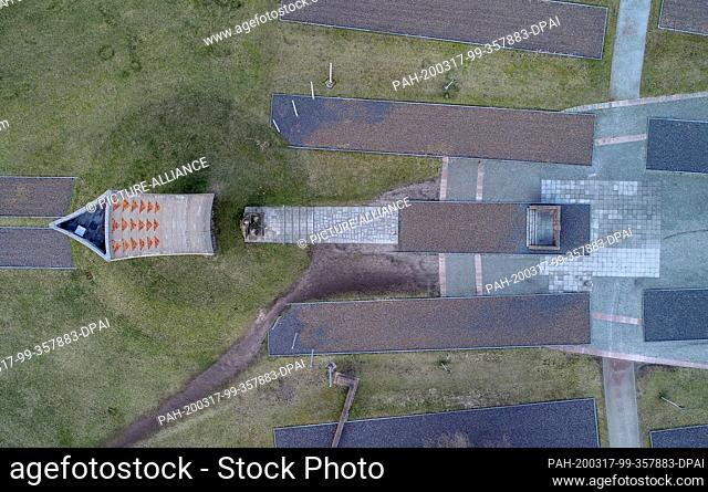 04 March 2020, Brandenburg, Oranienburg: The obelisk and outlines of the former camp barracks on the grounds of the Sachsenhausen Memorial Site (aerial photo...