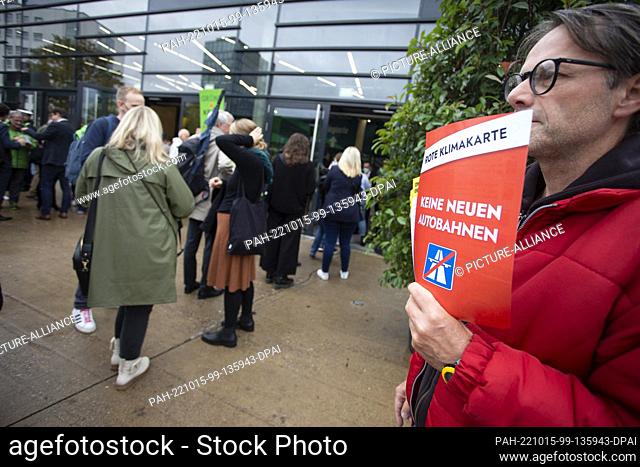 14 October 2022, North Rhine-Westphalia, Bonn: A sign reading ""Red climate card. No New Highways"" is held up by a demonstrator before the start of the Green...
