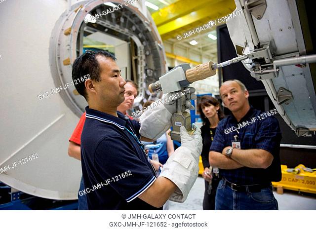 Japan Aerospace Exploration Agency (JAXA) astronaut Soichi Noguchi (foreground) and NASA astronaut T.J. Creamer, both Expedition 2223 flight engineers; along...