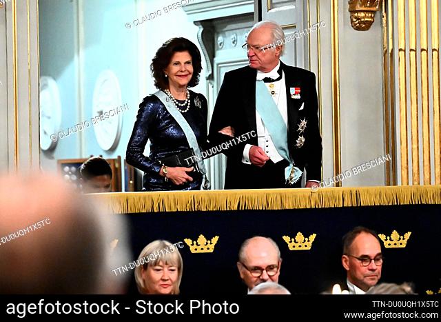 Queen Silvia and King Carl Gustaf arrive to the Swedish Academy's annual festive gathering in the Great Stock Exchange Hall in the Börshuset in Stockholm