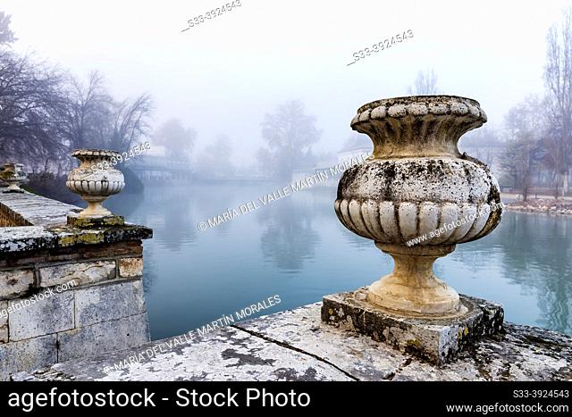 Historic flower pots and fog at river Tagus in Aranjuez. Madrid. Spain. Europe