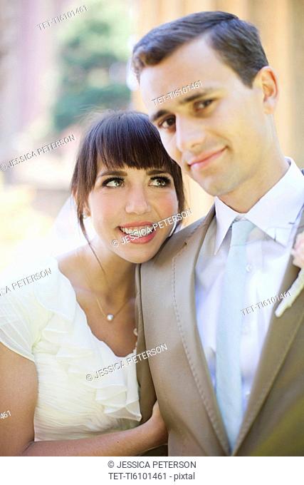 Portrait of young bride and groom