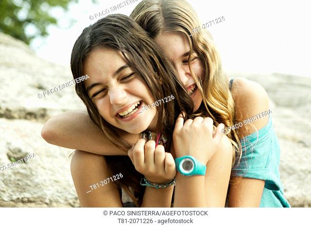 Teenage friends hugging. Valencia, Spain