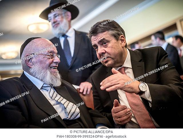 08 March 2018, Germany, Berlin: German Foreign Minister Sigmar Gabriel (R) of the Social Democratic Party (SPD) speaking to the rabbi Dayan Chanoch Ehrentreu...