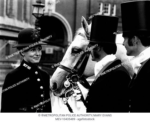PC Carol Price chats to PC Dave Edwards with his horse, and PC Stephen Cass. Carol Price was the last policewoman ever to wear this uniform on the streets of...