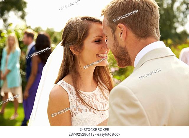 Romantic Young Couple Getting Married Outdoors