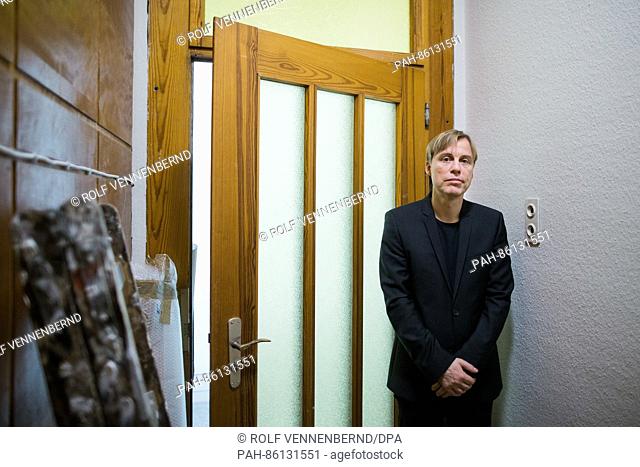 The artist Gregor Schneider stands in the Federal Art Hall in the room ""Haustür Haus u r"" (lit. ""Front door House u r"") in Bonn, Germany, 30 November 2016