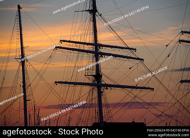 16 June 2020, Mecklenburg-Western Pomerania, Stralsund: The sailing ship ""Gorch Fock I"" is moored in the city harbour during the so-called blue hour