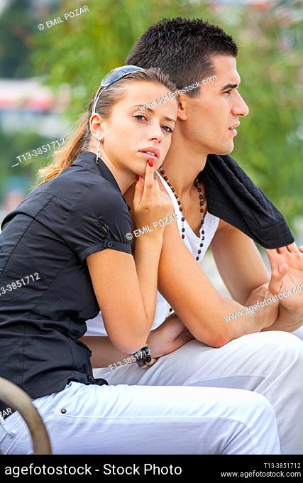 Teenage girl and boy together in a park