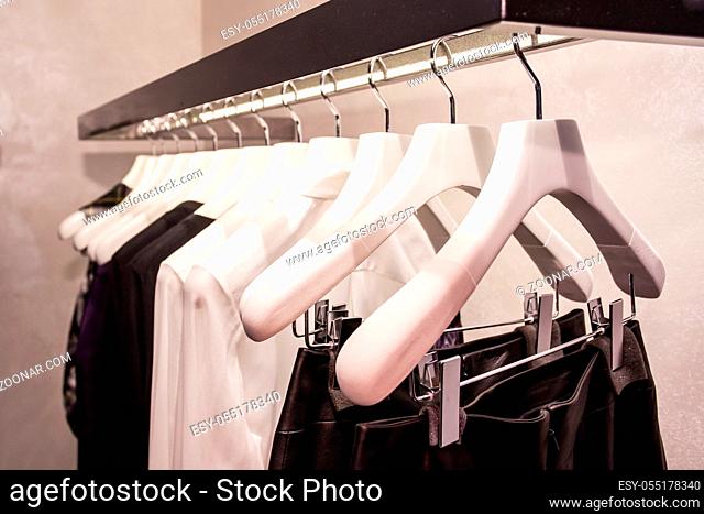 Clothes hang on a shelf in a designer clothes store in Melbourne, Australia