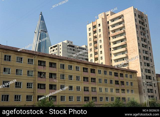 Pyongyang, North Korea, Asia - Residential buildings in the city centre of the North Korean capital with the top of the iconic Ryugyong Hotel in the backdrop